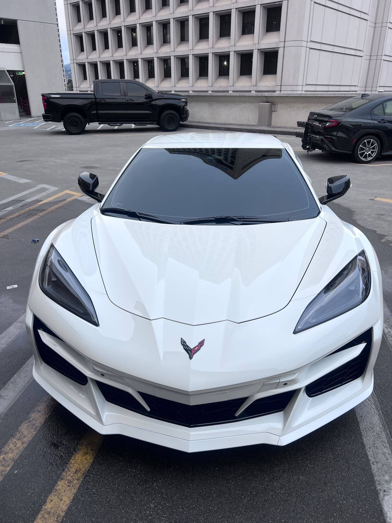 White Chevrolet Corvette, head-on, freshly detailed
