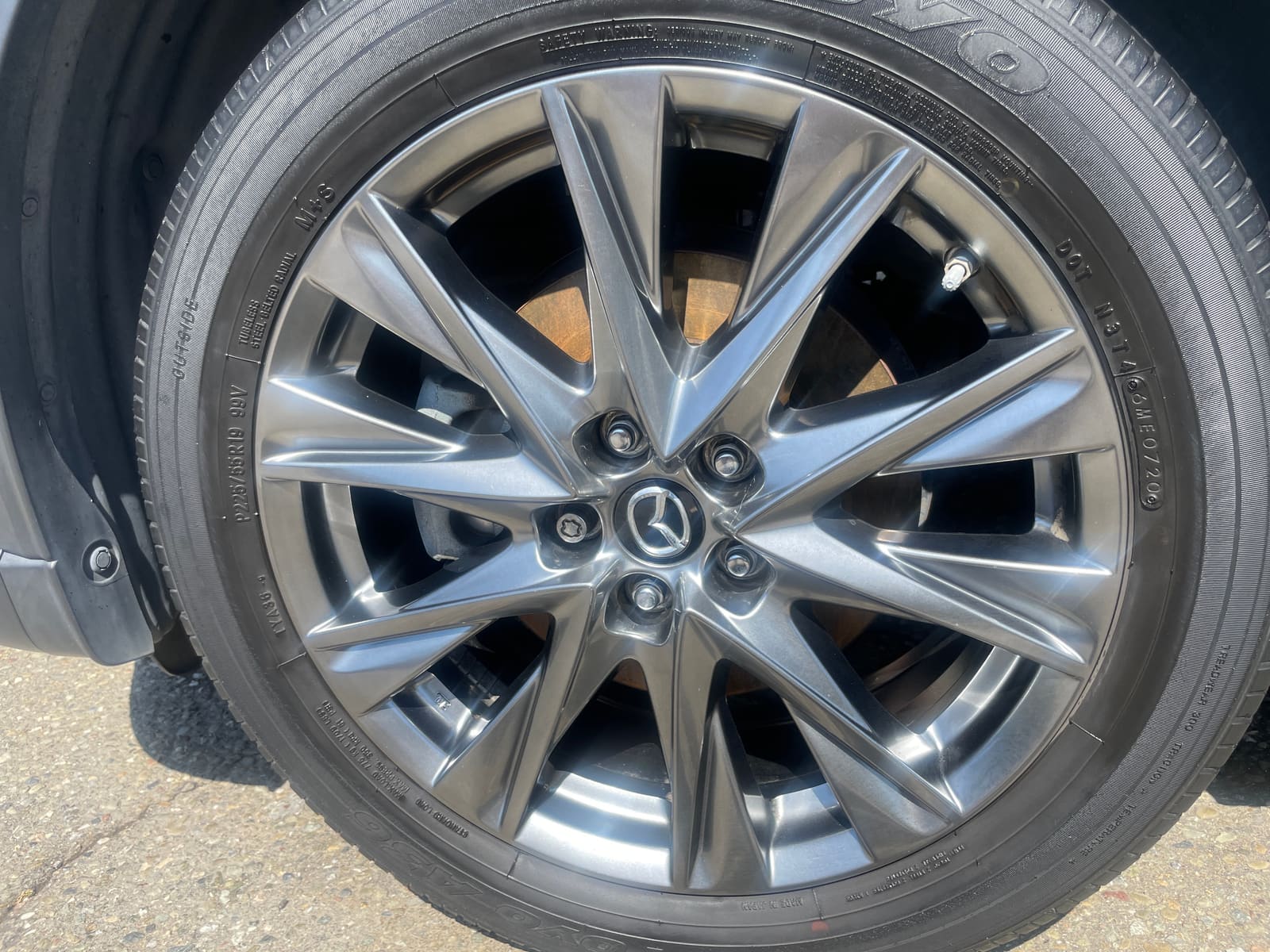 Polished alloy wheel and tyre, close up after a detail